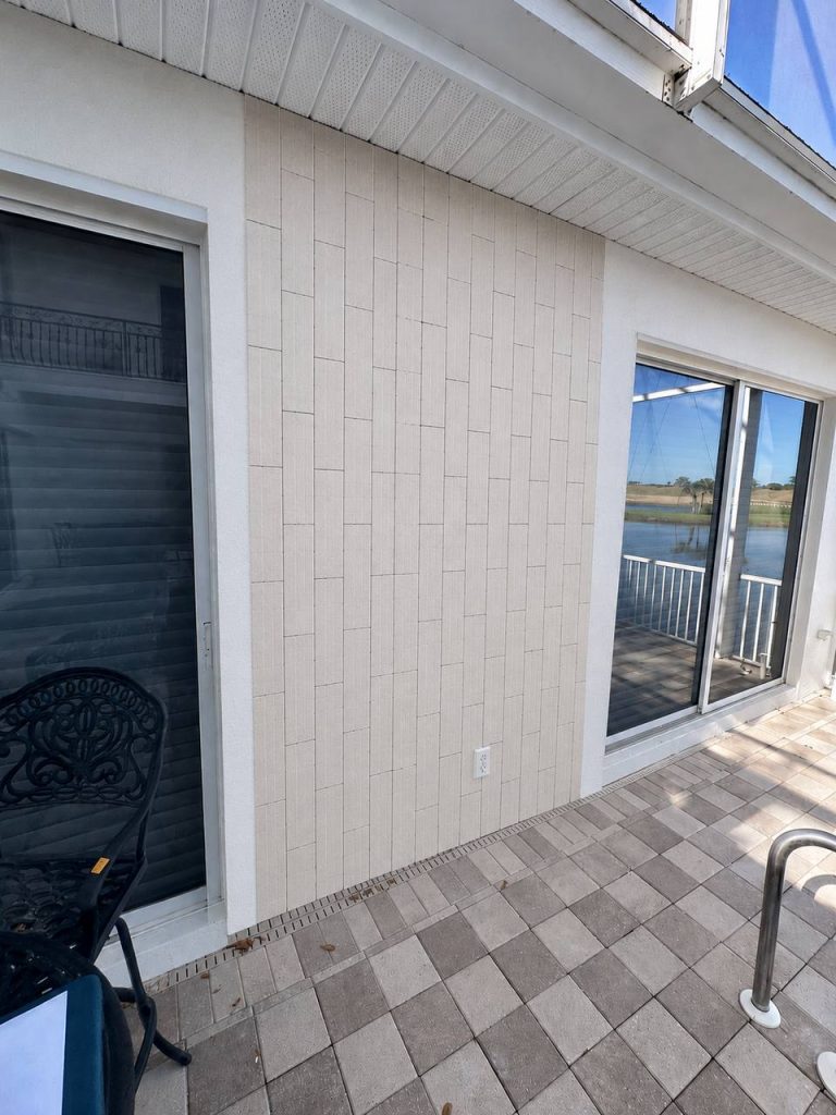Lakefront patio accent wall with vertical tile cladding