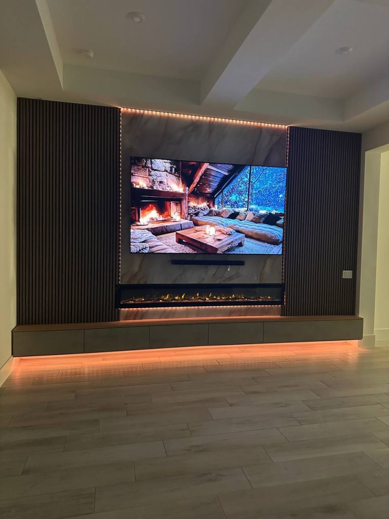 Media wall with amber LED glow, full room view
