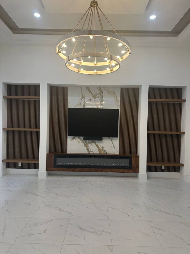 Marble media wall with built-in shelving, side view