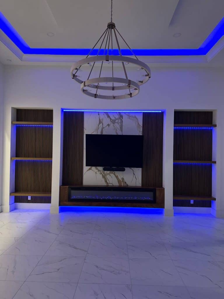 Marble media wall with blue LED niches at night