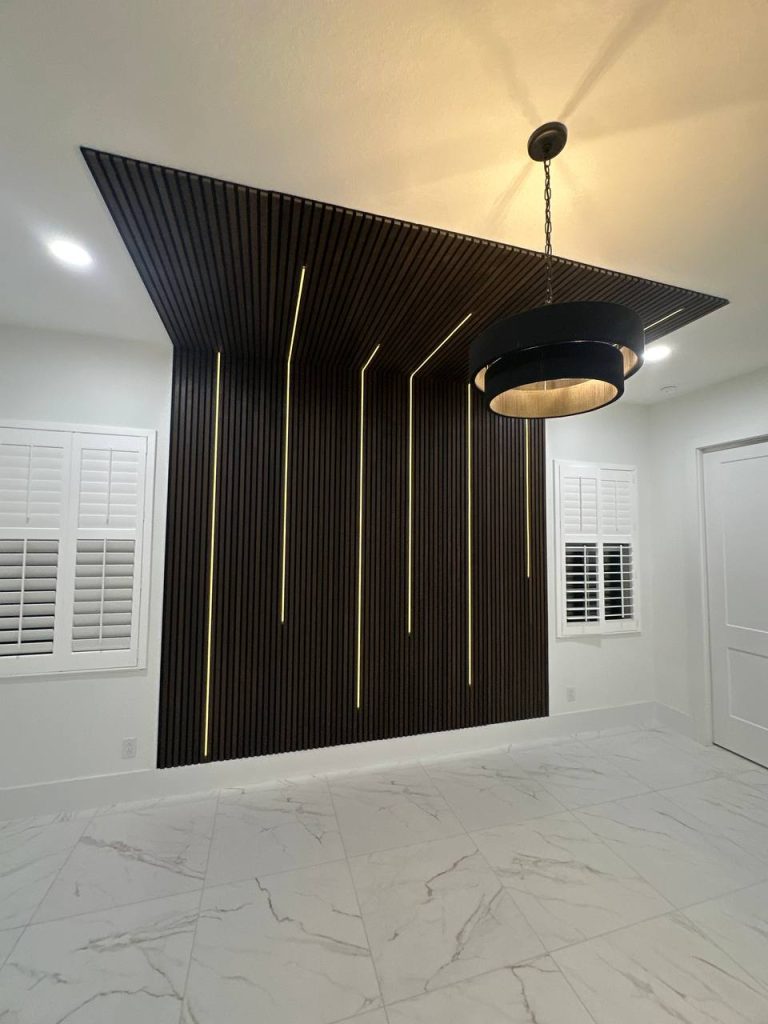 Custom walnut slat accent wall with integrated gold LED lighting