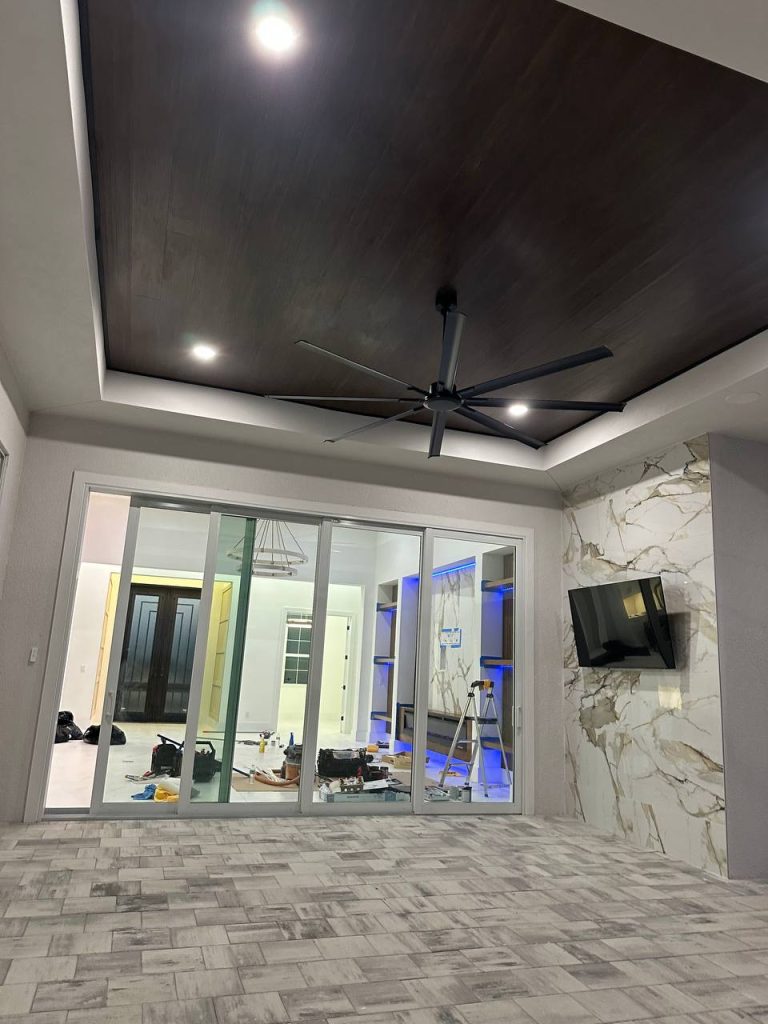 Wood tray ceiling in living room with marble accents